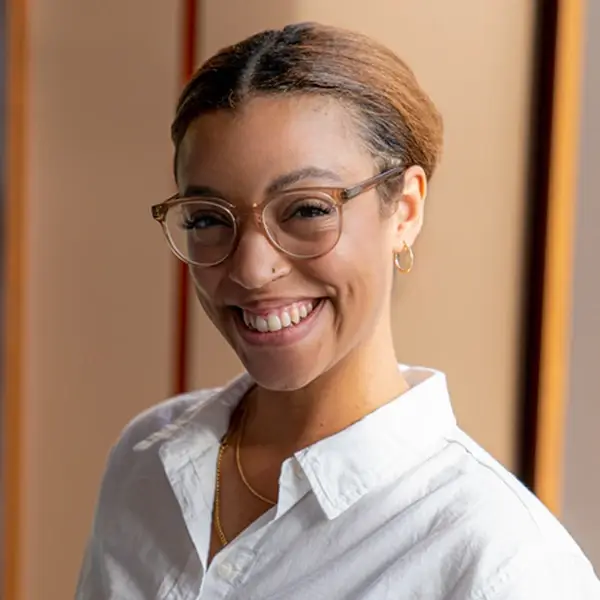 Portrait of smiling young woman of color